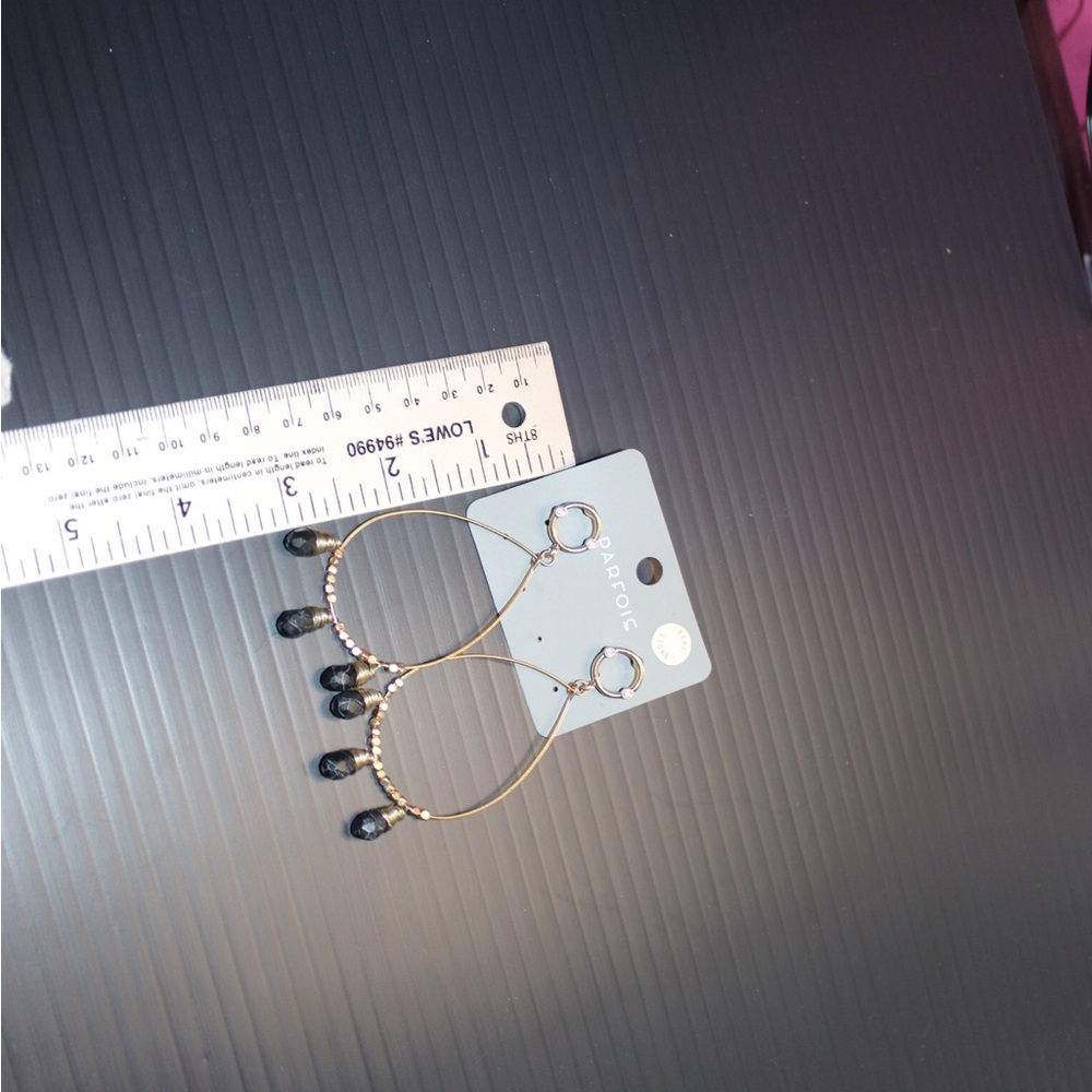 Beautifully designed earrings, gold tone with Blackstone